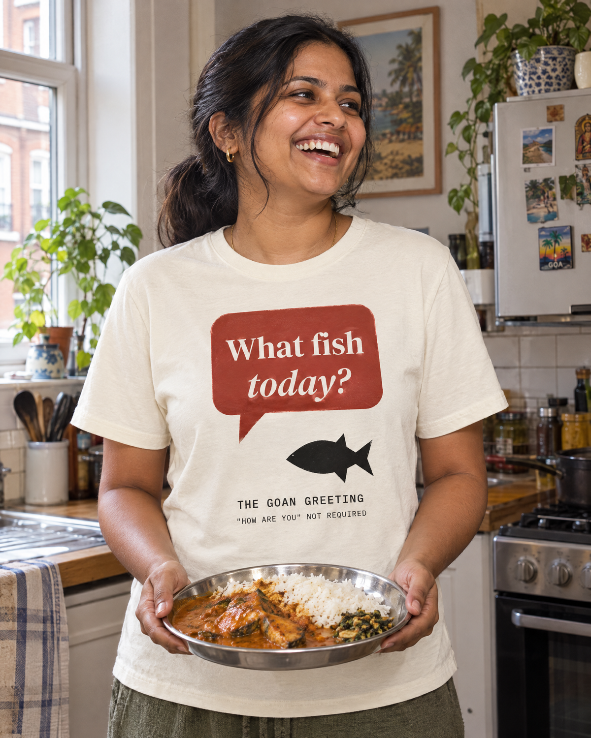 Lifestyle image (AI-generated illustration): woman wearing the What Fish Today? Tee in Natural Raw, holding fish curry and rice